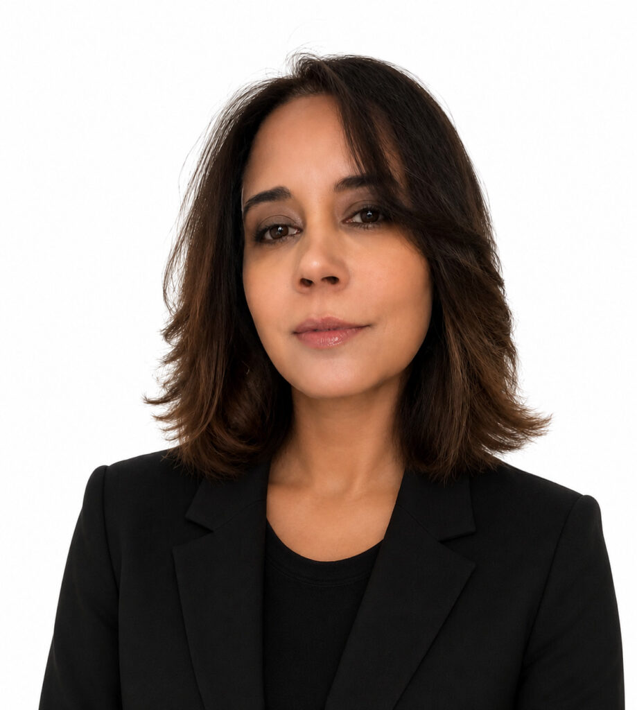 Confident woman with shoulder-length brown hair in a black blazer.